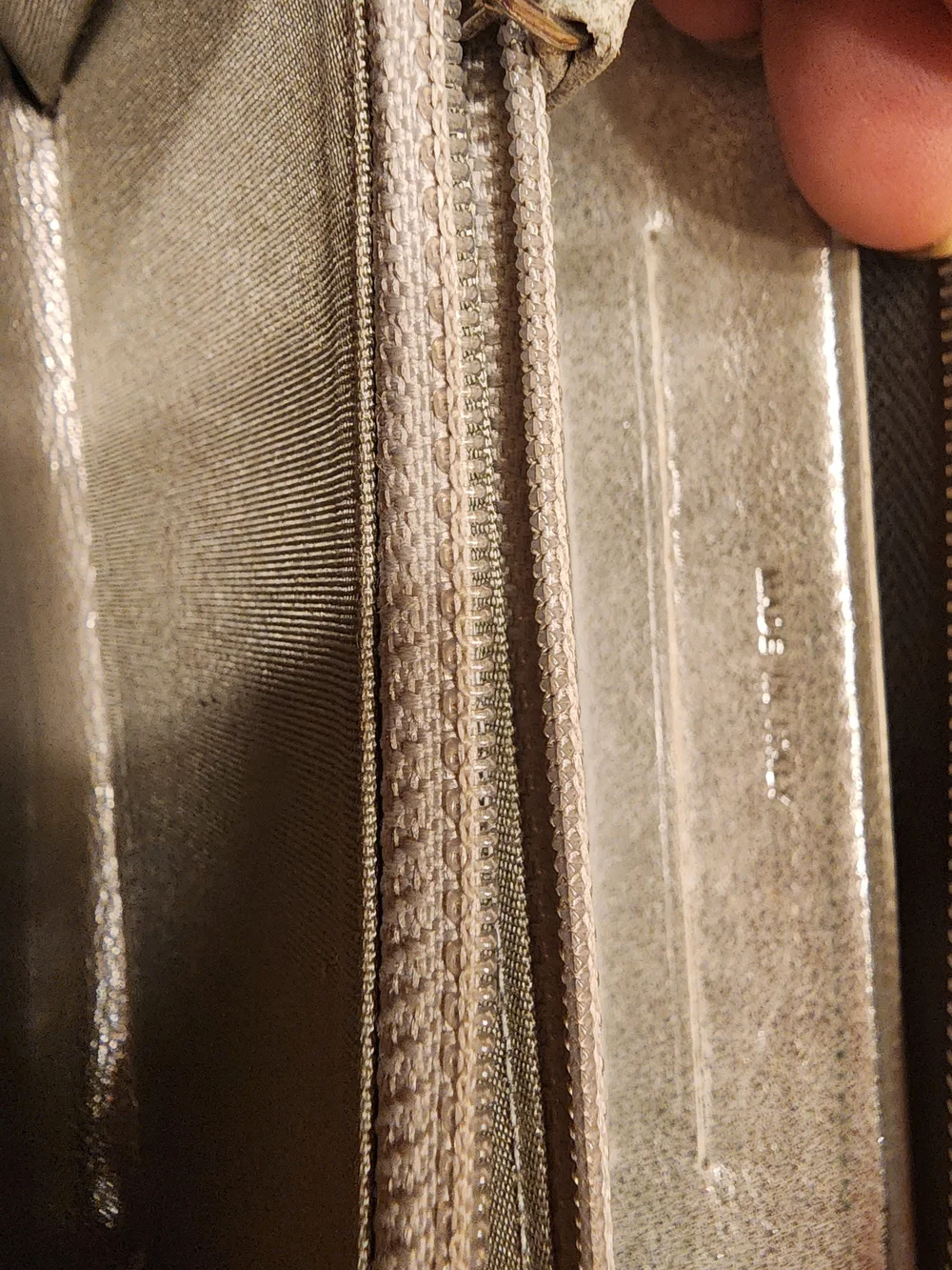 Chanel Timeless CC zip-around wallet features smooth black leather
